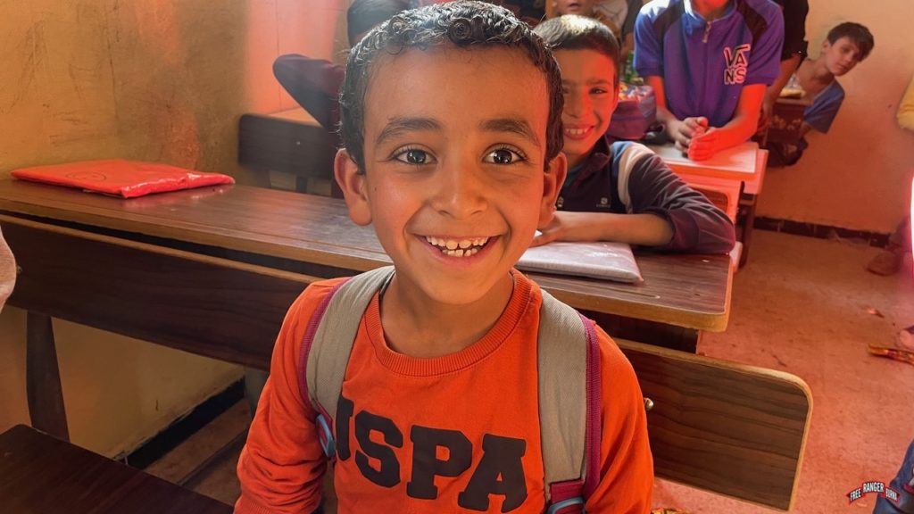 Happy child at new Baghouz school.
