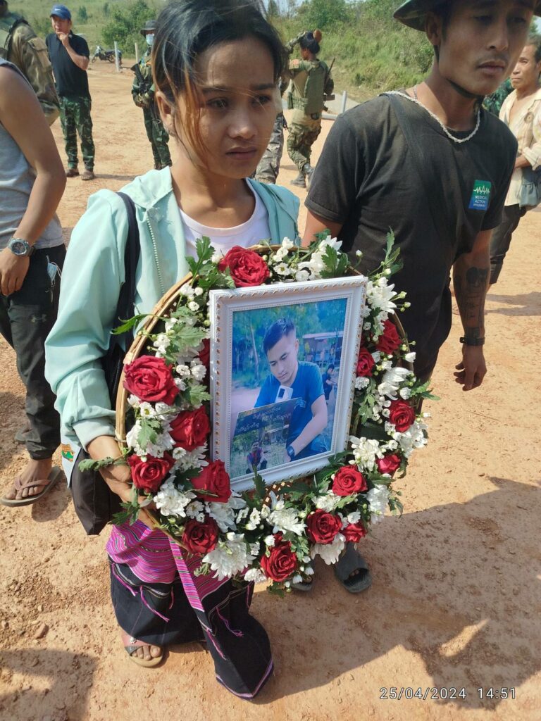 Friends of Chan Thar honor him at his funeral.