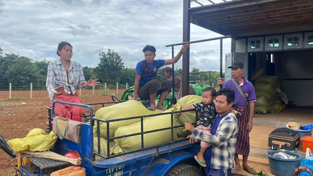 Families moving rice as Burma Army approaches.