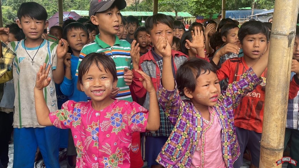 Irrepressible joy as children sing in spite of attacks.