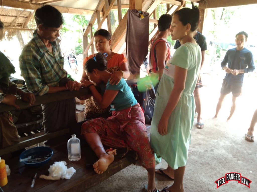 Woman injured by shrapnel to her lower leg. 