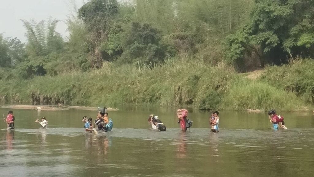 Villagers fleeing Burma.