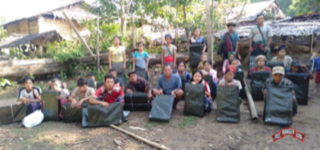 Villagers receive tarps in Butho Township.