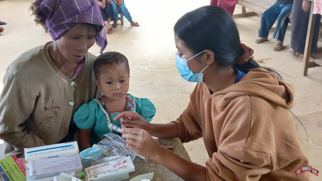 FBR Ranger medic consults IDP family. 