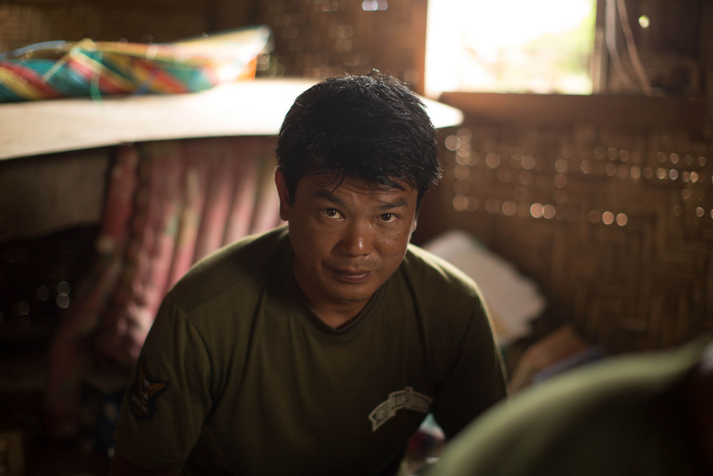 Ranger in a dark room looks at the camera