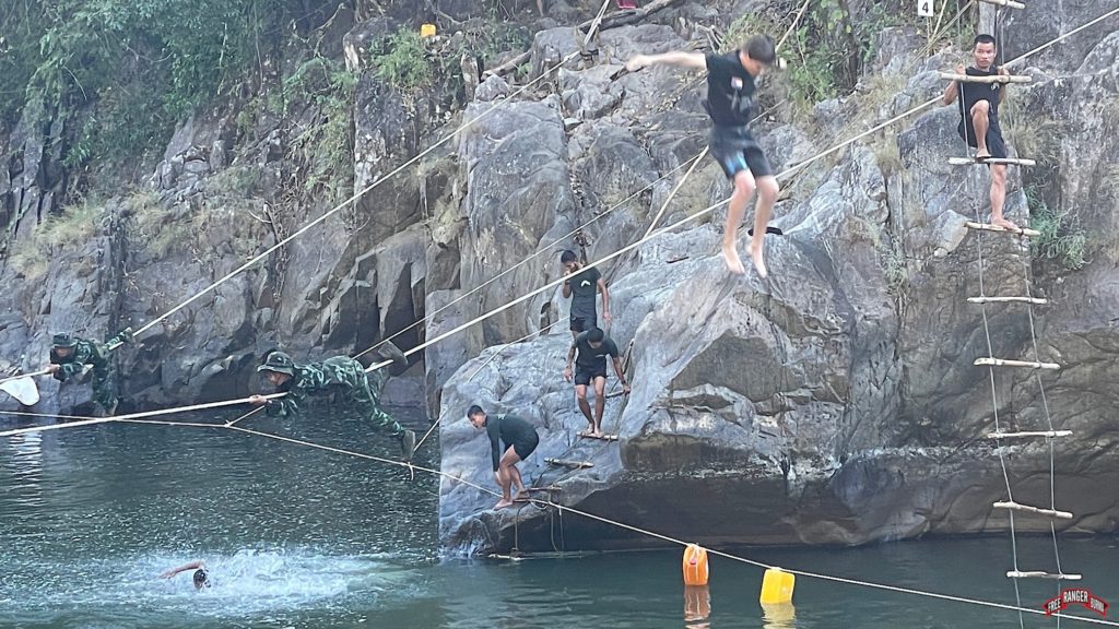 Rappelling, swimming, and rope bridge training at the river