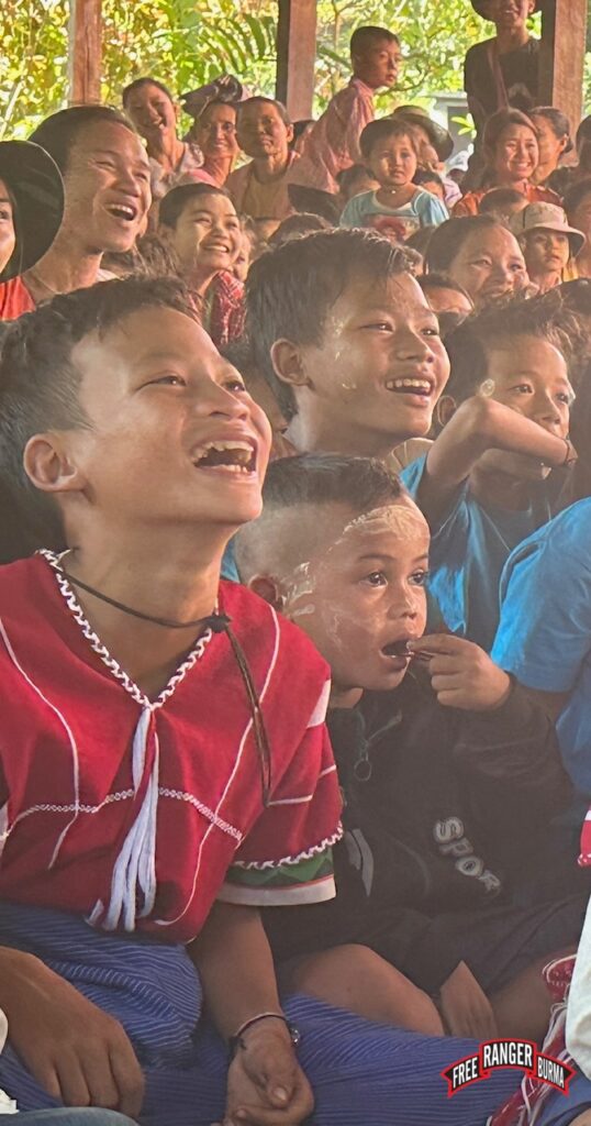 Kids watching a skit.