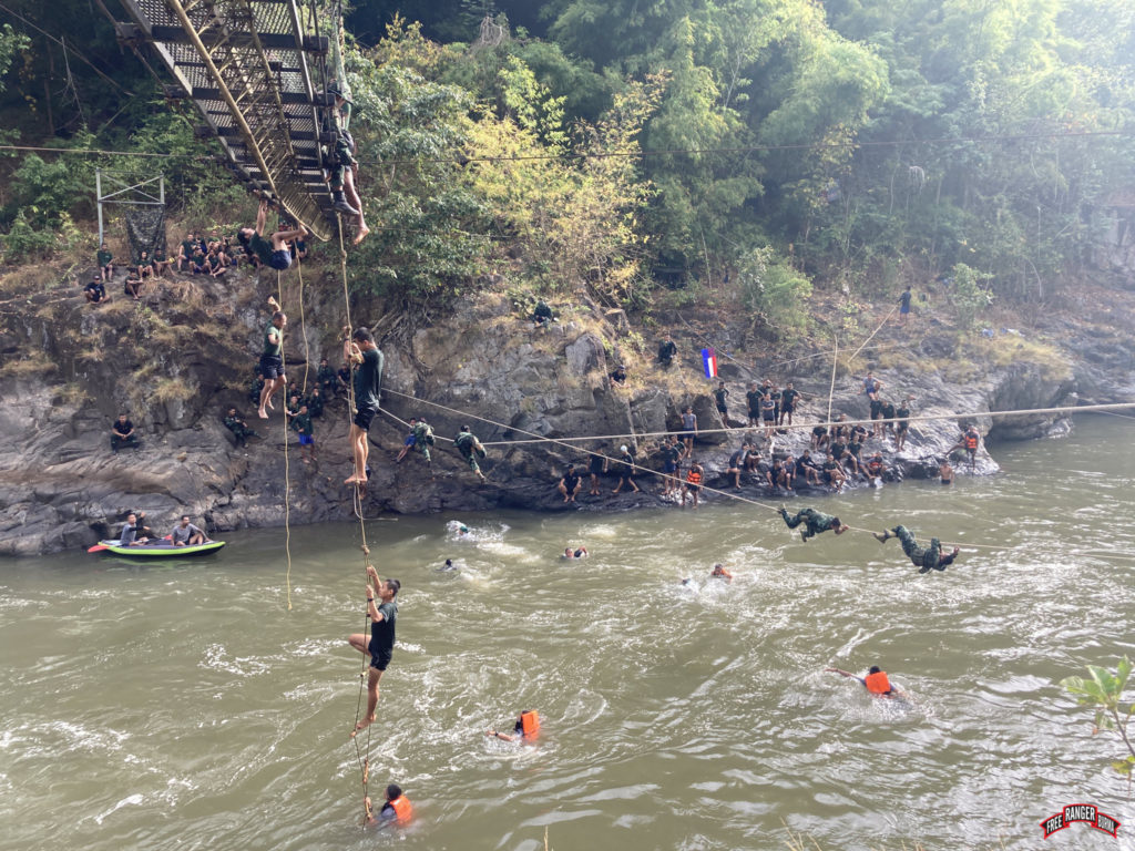 Rappelling, swimming, and rope bridge training at the river.