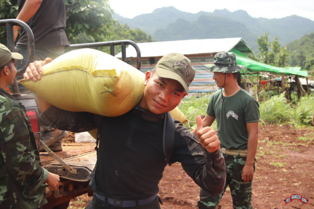 Ranger distributes rice to IDPs in Khout Ton Village during a GLC program.