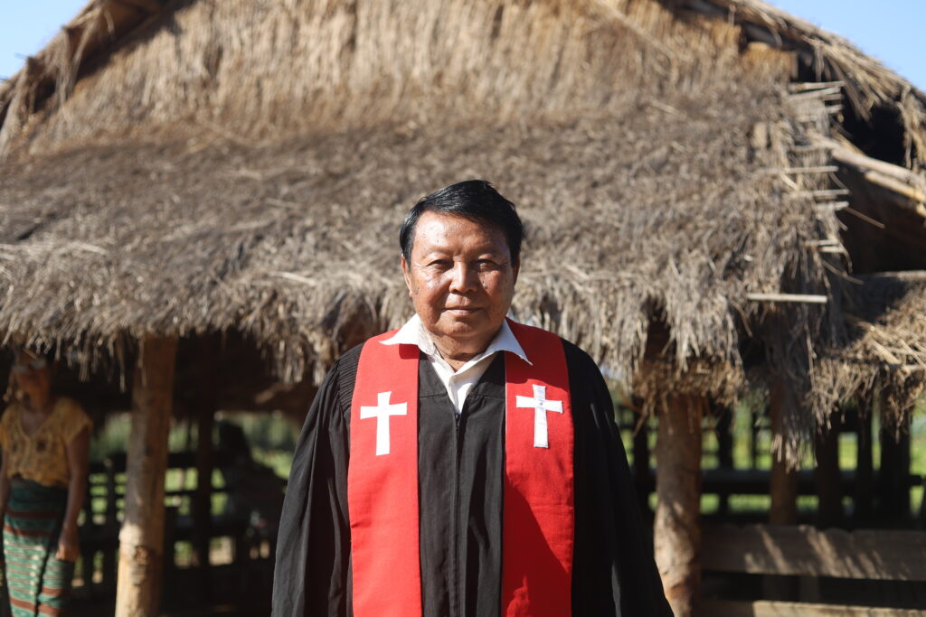 Reverand Saw Lerr Moo in front of his IDP Church