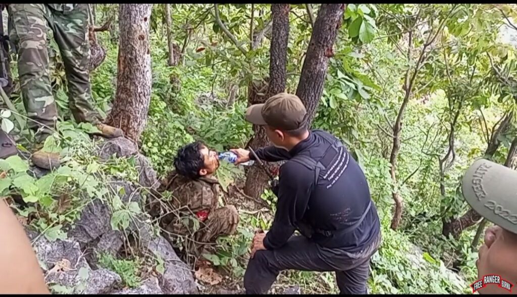 FBR Karenni team providing water to a surrendered Burma Army soldier.