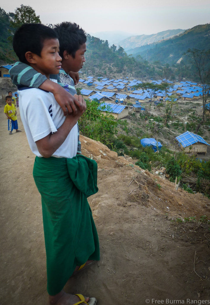 Young Kachin boys look over one of 17 IDP camps that the Kachin have been forced to relocate to because of on-going violence in the area.