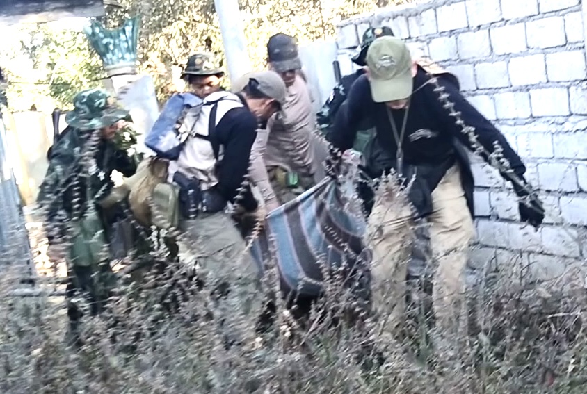 Carrying Francis out of the kill zone.