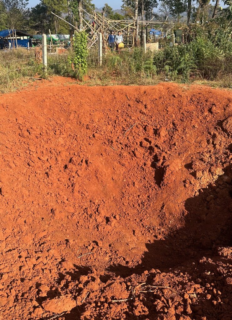 Surveying the Bomb Crater.