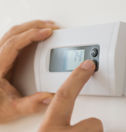 Wall thermostat used to control indoor temperature