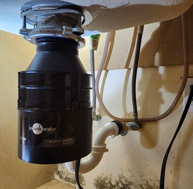 New garbage disposal connected to the kitchen sink drain in Arcadia, CA