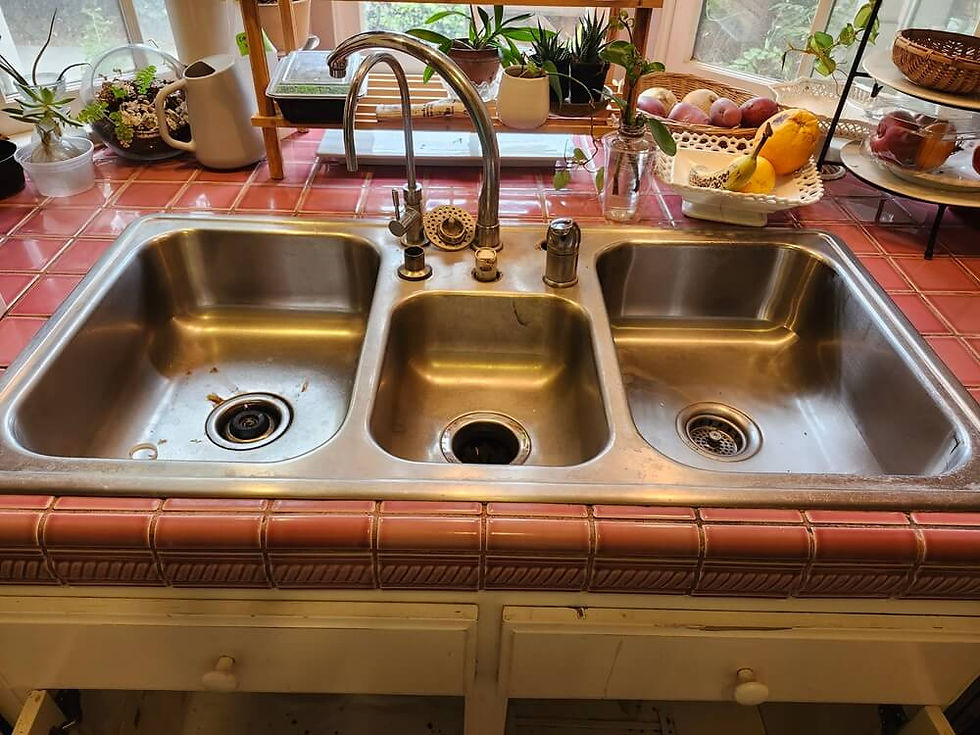 Existing three-bowl stainless-steel kitchen sink before replacement in Alhambra.