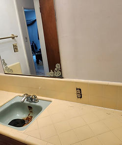 Old bathroom vanity and sink before replacement in Altadena