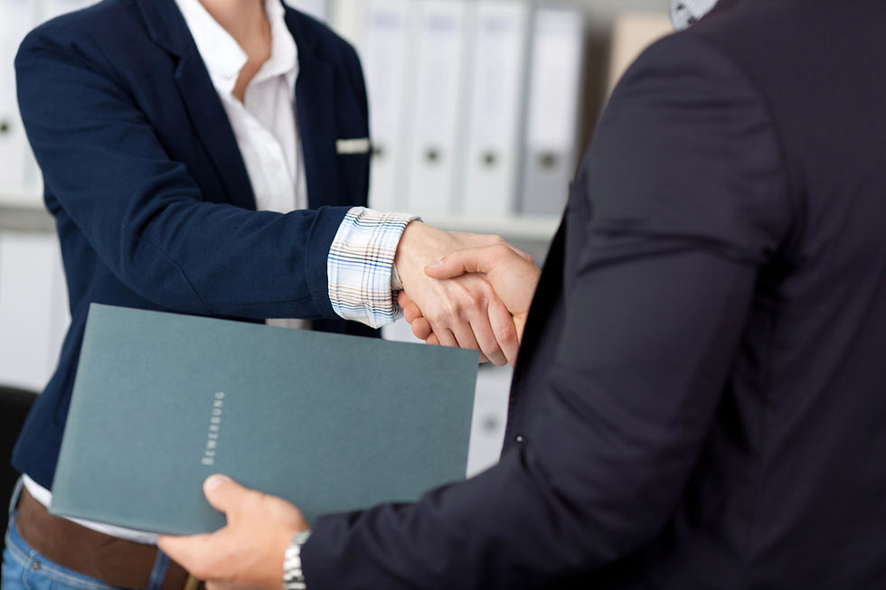 Business handshake with a document in the foreground, professional business agreement.
