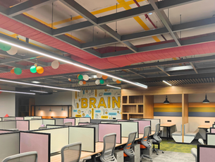 Modern office with an integrated HVAC system, featuring ceiling air vents and efficient airflow distribution for comfort and productivity.