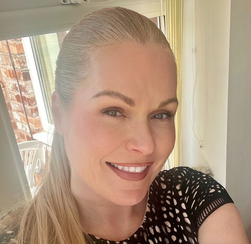 Portrait of Penelope Silver, a soul-led business coach and Reiki practitioner, smiling confidently in natural light. Her presence reflects authenticity, warmth, and grounded feminine energy.