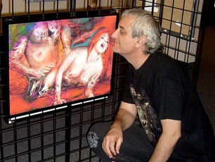 Erotic artist Samarel kneeling by his art at the world erotic art museum, Miami USA