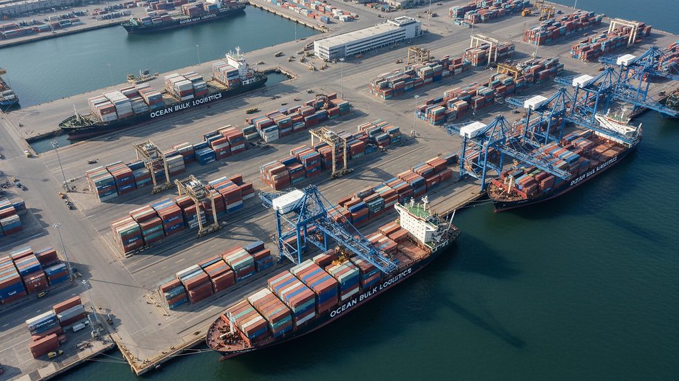 High angle view of cargo ships docked at a busy port