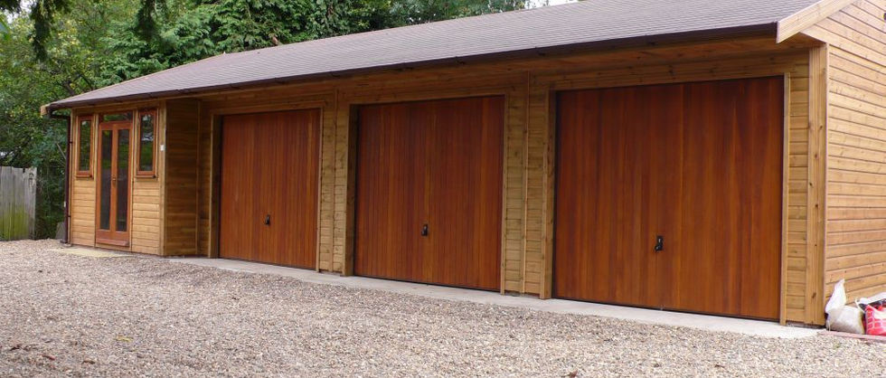 Triple wooden garage and garden office