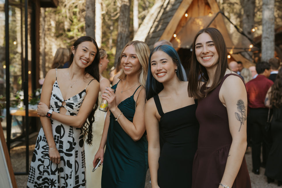 Wedding guests enjoying drinks during an outdoor cocktail hour at The Valley near Edmonton.