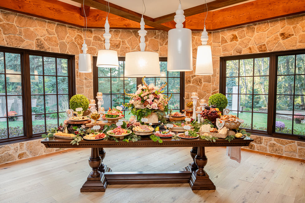 Colourful wedding charcuterie grazing table with florals at a private wedding in Edmonton, Alberta.