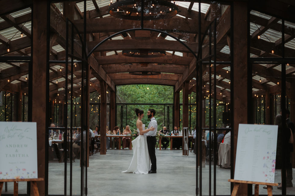 Bride and groom standing inside The Valley during their wedding reception.