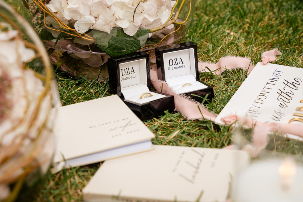 Personalized wedding details styled with soft pink flowers at an Edmonton private-property wedding.