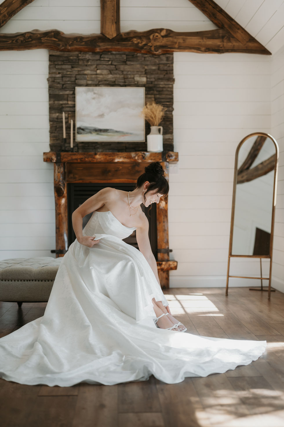 Bride in her wedding dress inside The Valley getting-ready suite before her first look.