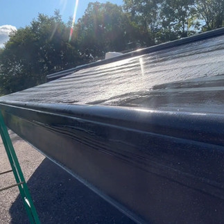 top of wet rv awning with step ladder on the left