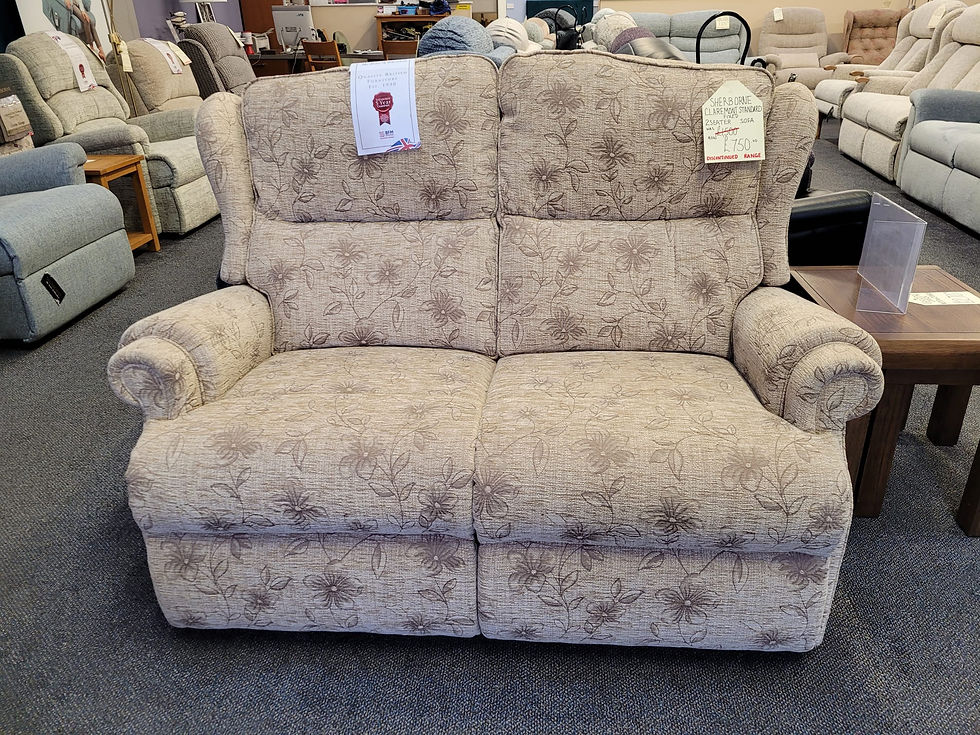 Sherborne Upholstery, stylish monochromatic neutral floral print sofa with pillow back.