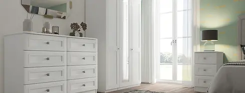 White shaker wardrobes, White traditional chest of drawers, White modern shaker mirrored wardrobe, Beautiful clean bedroom design and furniture.