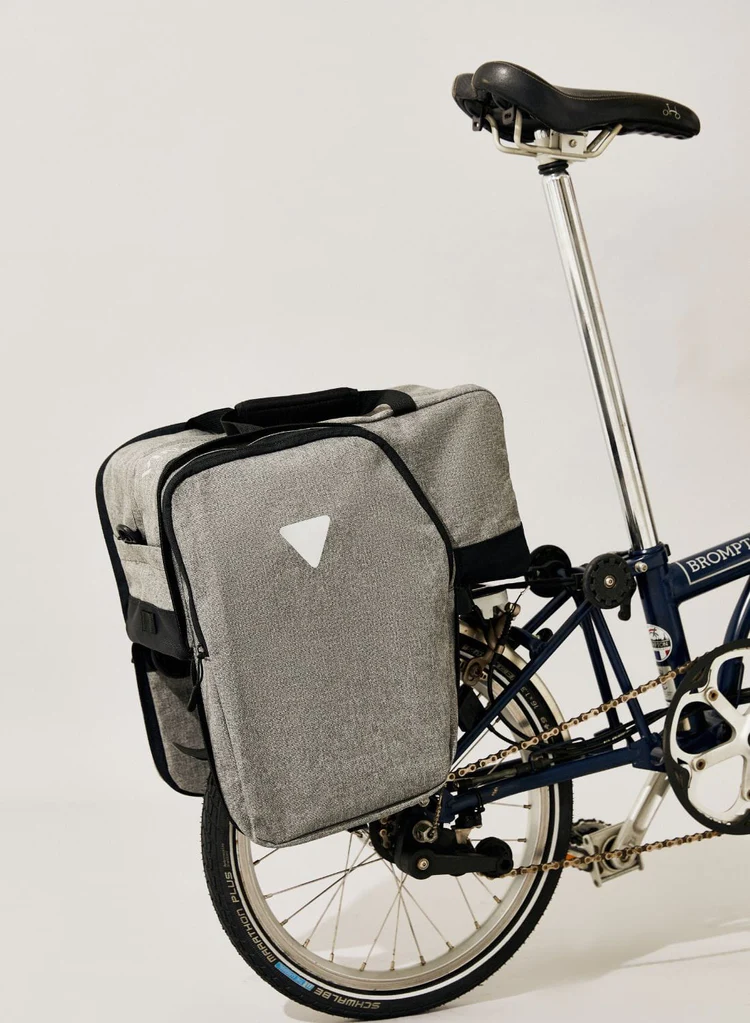 Brompton bike with Vincita Nash bag with side pockets open on rear rack