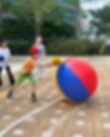 Young boy throwing a ball during an outdoor sports event Island Sports HK.