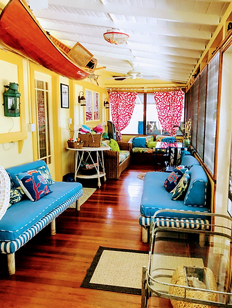 front porch with wooden canoe