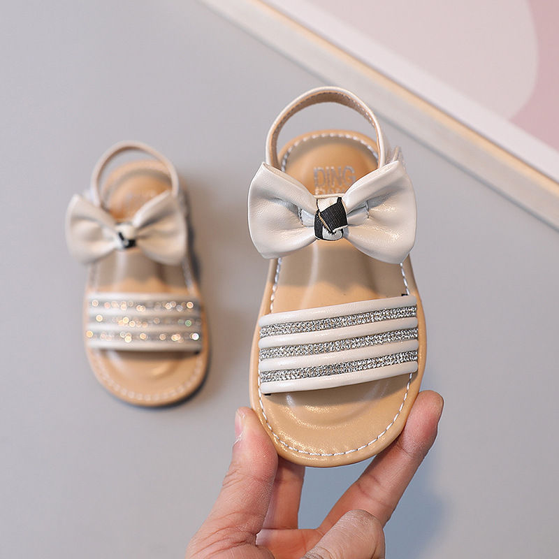 Thumbnail: BEADED STRIPE BOW APPLIQUE VELCRO CLOSURE SANDAL -BEIGE