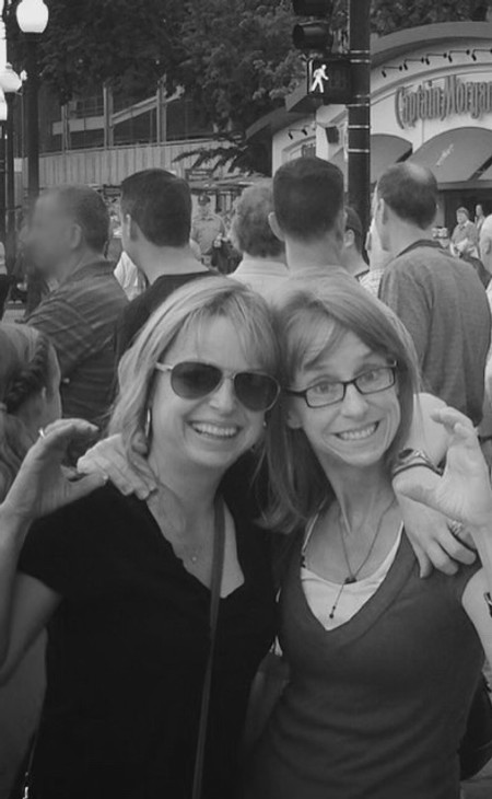 Jennifer and her sister Julie signing
