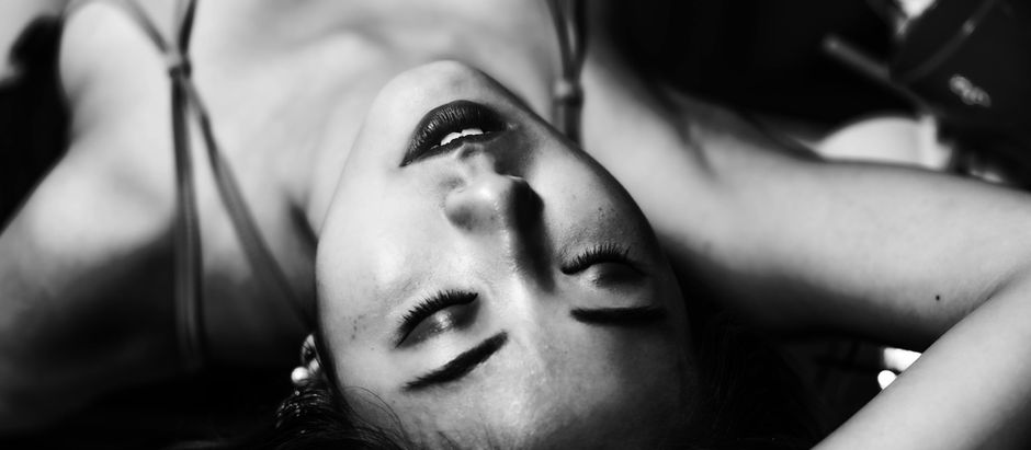 Woman lying on her back having a desirable fantasy
