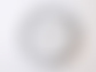 A round wall clock with black numbers and hands, an orange second hand, and the brand name Geekcook on a white background. Time shows 10:09.