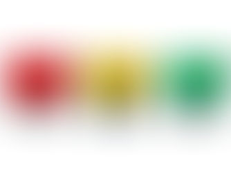 Three caravan fuses in red, yellow, and green are lined up on a white background. They have transparent plastic casings and metal prongs.
