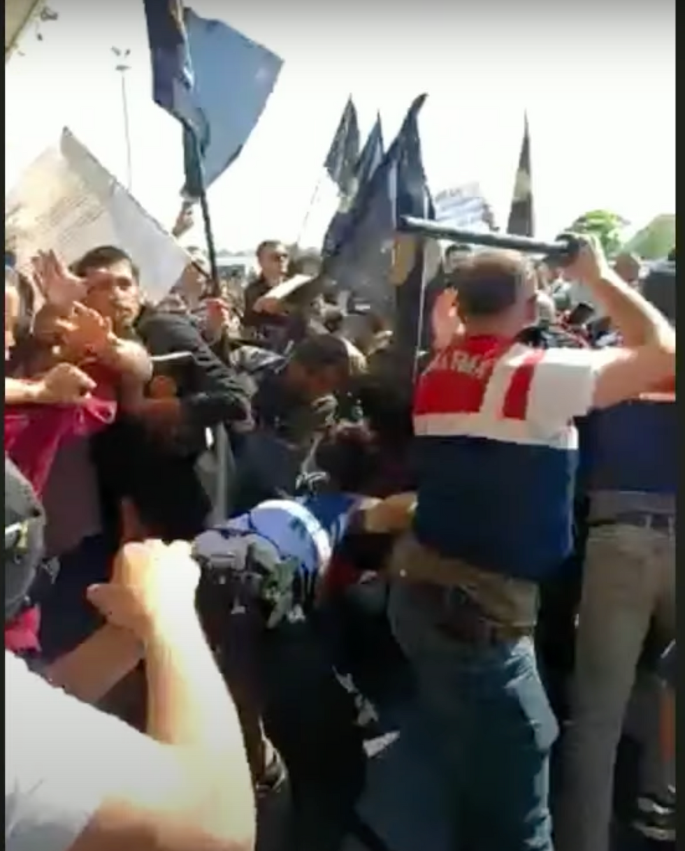 Turkish border guards beating the believers