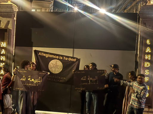 Group of AROPL believers peacefully rallying outside Shah Rukh Khan's Mannat residence with unity banners, promoting interfaith harmony and "Humanity First."