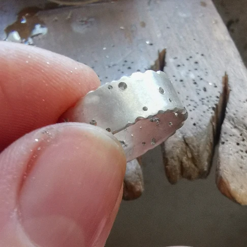 Ring making process - silver ring with holes drilled in