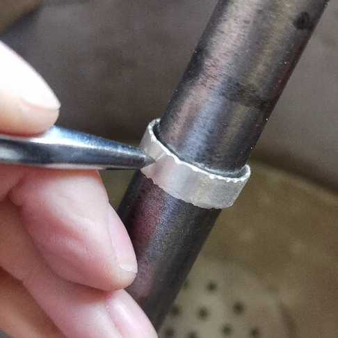 Drilling holes in a silver ring