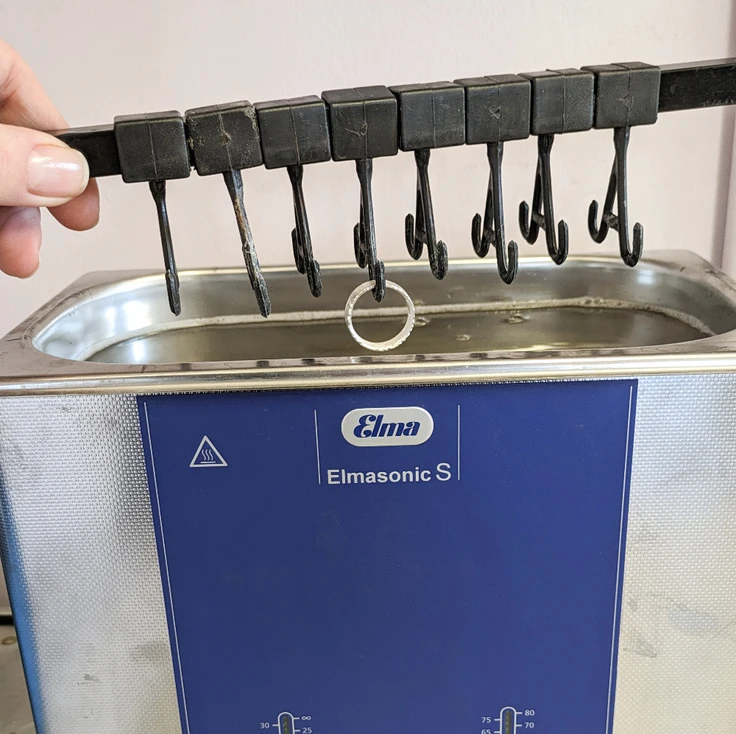 Using an ultrasonic bath to clean a silver ring