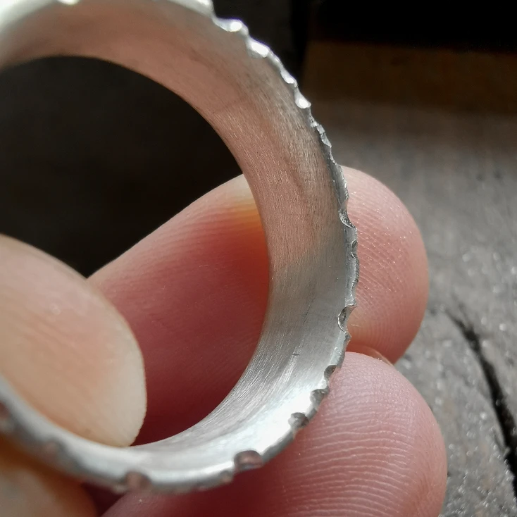 Nibbled edges on a silver ring - ring making process